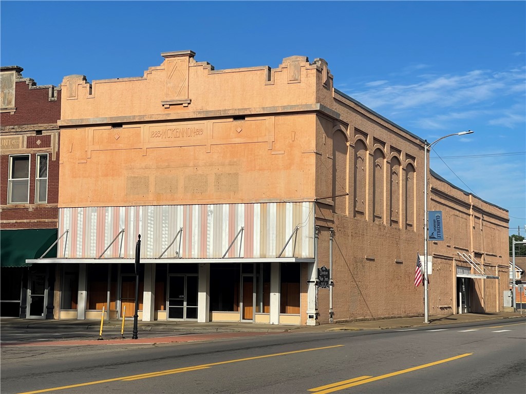 HISTORIC MONUMENT BLENDS WITH A SUCCESSFUL MIX OF LOCATION, SPACE, AND FUNCTIONALITY! Stepping inside a 15,000+square-foot, commercial retail shell/office building is an exercise in scale. To put that size into perspective, it is roughly the size of three full NBA basketball courts placed side-by-side. It is truly a "blank canvas"- the space is remarkably vast and loaded with infinite potential. First floor and upper floor are each 7,310 square feet. Plus there is a basement consisting of 1720 sq. ft. PREMIER investment opportunity, zoned as C-3 with OPPORTUNITY ZONED plus HUBZONE qualified. Tax credit eligible. EXCELLENT location, part of the JOHNSON COUNTY COURTHOUSE SQUARE. The corner placement commands attention and offers 2 main entrances--one off Main Street and the other off Fulton Street. **MORE PHOTOS COMING SOON!