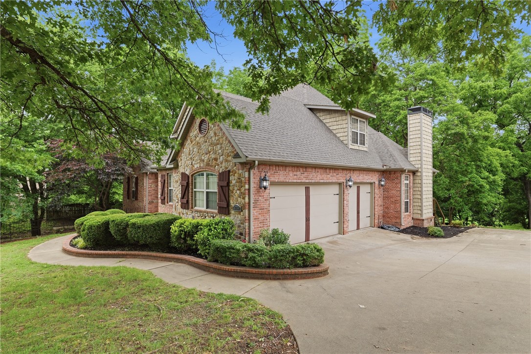 Welcome to your private, all-brick estate retreat—perfectly balancing acreage living with quick access to I-49. Sitting on 1.97 beautifully cleared acres, this stunning home is designed for entertaining. The main level showcases a spacious primary ensuite, a dedicated office, formal dining, two distinct living areas, and a large three-car garage. Eat in Kitchen features double ovens, gas range, stainless appliances & prep island.  Upstairs, you will find three additional bedrooms with walk-in closets, an adjoining bath, & a large bonus room, with wet bar, perfect for movie nights or a play space. For even more flexibility, the fully heated and cooled basement offers endless possibilities as a workshop, home gym, or extra living quarters. Step outside to the extended back deck to enjoy gorgeous views of your own private pond. Complete with recent updates including fresh flooring, modern quartz countertops, painted bathroom cabinetry, and a newly cleared backyard, this incredible property is completely move-in ready.