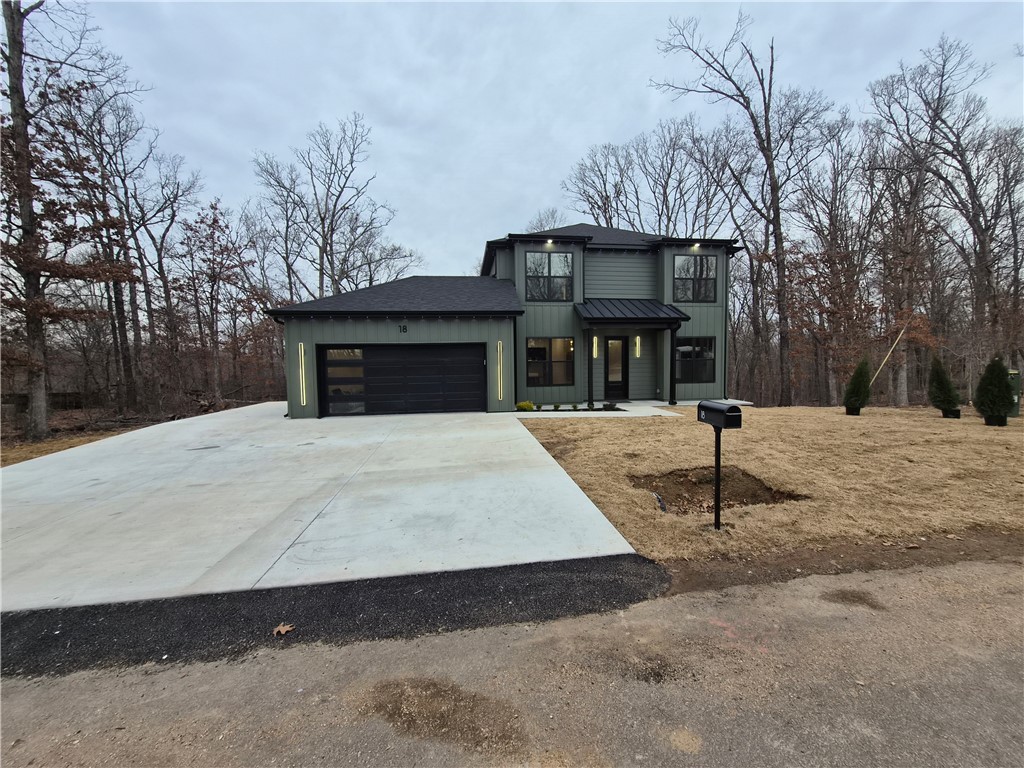 Contemporary new construction offering a flexible layout designed for modern living. This 3-bedroom, 2 full + 1 half bath home lives larger than expected with two living areas and two laundry rooms—one on each level, making it a great option for families, guests, or work-from-home needs.

Built with 2x6 framing and blown cellulose insulation for improved efficiency and comfort. The exterior features Alside Ascend composite siding, delivering the look of wood with low maintenance and long-term durability.

Inside, you’ll find 10-ft ceilings, solid-core 8-ft doors, LVP flooring, and a bright open layout. The designer kitchen stands out with custom slim Shaker cabinetry, quartz waterfall island, gold hardware, full-height backsplash, pantry, and coffee bar.

The primary suite offers a double vanity and floor-to-ceiling tiled shower with glass enclosure. Upstairs provides a second living area ideal for media, office, or guest space. Enjoy a covered composite deck overlooking peaceful wooded views.