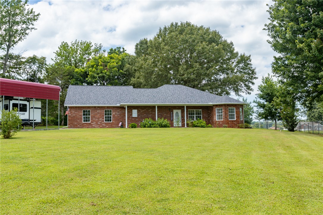 Immaculate, move-in-ready all-brick home in a peaceful country setting just south of Harrison! Pride of ownership is evident throughout this beautifully maintained home featuring a new roof (Feb. 2026) and a new water softener (2025). Enjoy relaxing on the spacious covered back patio while watching birds and local wildlife. The well-designed kitchen offers abundant storage and a double oven, making it perfect for everyday living and entertaining. RV owners will appreciate the covered RV carport, 12 X 35, 18 ft high, with a 30-amp hookup and dedicated parking pad. You’ll love the quiet surroundings while being just 10 minutes from downtown Harrison and only 45 minutes from Branson, where you’ll find shopping, dining, entertainment, and outlet malls. This exceptional property offers the perfect combination of country charm, modern updates, and convenient access to nearby amenities. Ready for you to move in and enjoy!