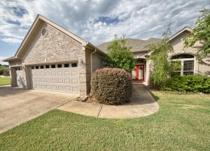 Lakeside Home with all of the upgrades! This gorgeous 4 bedroom, 2.5 bath home sits on over a .5 acre lot and backs right up to Indianhead Lake. Relax on one of 2 back patios and take in the views! With high ceilings, unbelievable moldings, a master suite to die for and a chef's kitchen, this home has it all. Sprawling 3 car garage for the cars and canoes as well as an additional parking pad for
