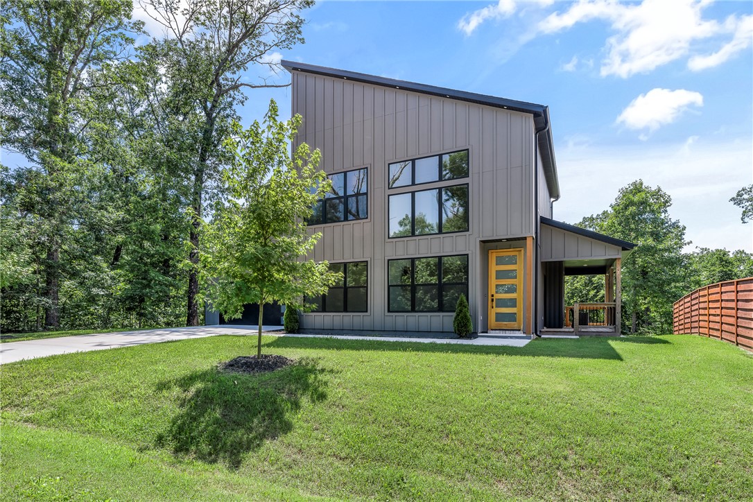 Make this stunning, newly constructed modern home yours! Thoughtfully designed with contemporary finishes and an open-concept layout, this home offers the perfect blend of style, comfort, and functionality. 
Featuring 2 bedrooms PLUS a dedicated flex room, this versatile floor plan is ideal for remote work, guests, or additional living space. The bright and airy interior showcases modern design elements, quality craftsmanship, and abundant natural light throughout. The kitchen flows seamlessly into the living and dining areas, creating an inviting space for everyday living and entertaining.
Enjoy the privacy and outdoor possibilities of this generous and LEVEL lot, with plenty of room to relax, garden, or create your own backyard retreat. Located near Bella Vista's renowned biking trails, lakes, golf courses, and recreational amenities, this move-in-ready home offers a fantastic opportunity to enjoy Northwest Arkansas living at its best.