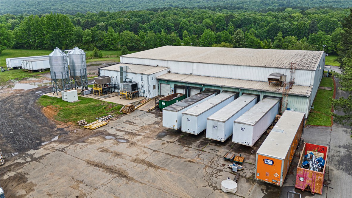 Just minutes off of I-40 this 28,000 sq ft manufacturing/warehouse site offers flexible usage located on approx 10 acres. The warehouse area features 25' side walls with 30' peaks, 6 loading docks and apprx 3,000' of office space.  City utilities and room for expansion if needed all on this site.