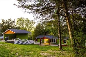 Discover a unique opportunity at 8431 Navajo TR in Rogers, Arkansas. Built in 2007, this manufactured home offers 1792 square feet of living space, presenting a thoughtful layout for comfortable living. This home qualifies for RD, VA and FHA financing as real property. This residence provides four bedrooms, offering versatile space for various needs, from personal retreats to creative studios. Accompanying the bedrooms are two bathrooms, designed to facilitate daily routines with ease. To truly appreciate the thoughtful design and functionality of this property, schedule your personal viewing today.