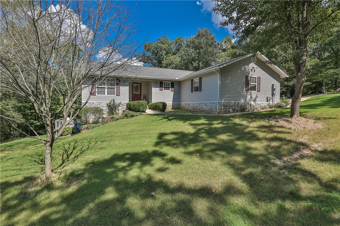 Great home with lots of space and privacy! Located on a quiet lake area cul-de-sac but still extremely convenient to HWY 71. Spread out in this large open floor plan with 3/4 BR, finished basement w/wet bar and large office! Huge Master Bedroom features on suite w/ dual sinks, whirlpool & shower. Upper & lower decks w/ private wooded view for entertaining or watching kids play with Seasonal views of Lake Rayburn. Great workshop area located in basement with tons of storage.  Seller is offering a Home Warranty and a $2,000  allowance for upgrades or closing cost assistance w/ acceptable offer.