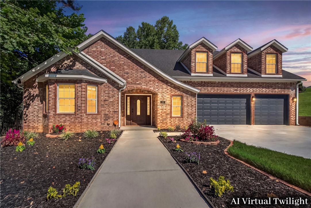 JUST LISTED!! $178sqft! OPEN HOUSE Sunday 7/12 12-2pm!! Don't miss this spacious 5-bedroom (could be 6 bedroom since Bonus Room has a closet), 4-bath home sitting on a .57-acre lot w/3-car garage. There's plenty of room both inside and out. The fully fenced backyard has a covered patio. The main floor offers 2 living spaces, formal dining room, a roomy kitchen w/ cozy coffee bar, wet bar, laundry room, plus a bedroom and full bath that's perfect for guests. Upstairs you'll find the primary suite w/a large walk-in closet with dresser, 3 more bedrooms, 2 full baths, a second laundry room, and a huge bonus/media room that could easily serve as a 6th bedroom. Wood and tile floors run throughout the home. Updates include fresh concrete overlay on driveway and all concrete areas, new outside light fixtures, freshly painted garage doors, new landscaping, a new roof (2024), HVAC system (2025), and tankless water heater (2022). All this in a great location close to a I-49, Walmart Headquarters and all that NWA has to offer.
