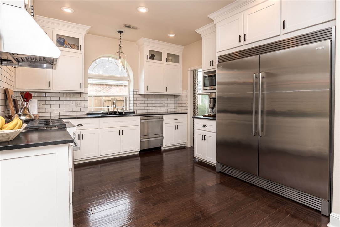 Gorgeous home in Saddlebrook community! Extensively remodeled with designer accents throughout! Home features hand-scraped hardwood floors, ship-lap wall in entry & living room, subway tile in kitchen, and stylish light fixtures throughout. Layout flows between living areas making it ideal for entertaining. Large living room has vaulted ceiling, natural light & gas fireplace with beautiful mantle. Kitchen has abundant cabinet space, soap stone counters, gas stove, and stainless appliances. Breakfast nook has access to the covered patio and backyard. Master bedroom has vaulted ceiling and hardwood floors as well as updated master bath & WIC. Two guest bedrooms and guest bath on upper level. This home is a MUST SEE!