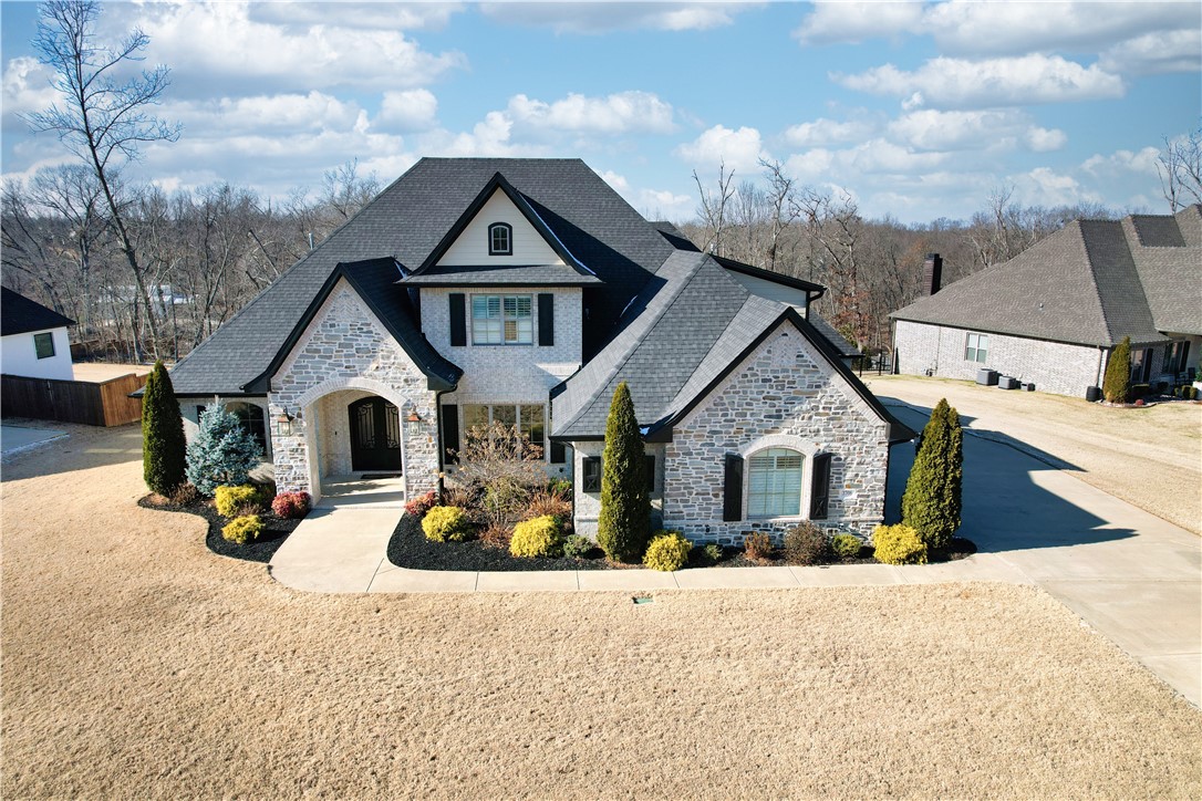 This like-new home in the coveted Copper Ridge subdivision offers the perfect blend of luxury and functionality with 4,600 sq. ft., 5 bedrooms, 4.5 baths, and a dedicated office.  The stunning open floor plan features hardwood floors throughout, creating a seamless flow between living spaces. The gourmet kitchen is a chef’s dream, complete with high-end appliances, custom cabinetry, and a butler’s pantry for added convenience and storage.  The main level includes four spacious bedrooms, including the serene primary suite. Step outside to relax and unwind in your private backyard oasis with a luxurious hot tub, perfect for year-round enjoyment. The beautifully landscaped yard, maintained by a front and backyard irrigation system, ensures effortless upkeep.  Located close to the new Walmart Home Office (Approx. 3 miles, lest than 10 minutes) schools, shopping, dining, and entertainment, with easy access to I-49, this home truly has it all. 
Schedule your private showing today to experience this exceptional property!