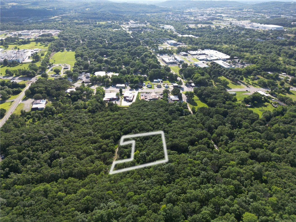 Can you imagine making a lot of money? This listing is vacant land in south Fayetteville. Near campus, and just off of S. School. This is a great location for rental properties, multi-family units, or whatever you can dream up! The land is zoned Residential/commercial! This listing is also tied to 4 other cash flow generating properties  MLS #'s 1311113, 1311625, 1311609, and 1311586! With an annual rental revenue from seven units—five older trailers and two homes that are all rented and performing extremely well! There's huge upside here. Whether you're looking for cash flow, land value, or future redevelopment, the numbers tell the story.