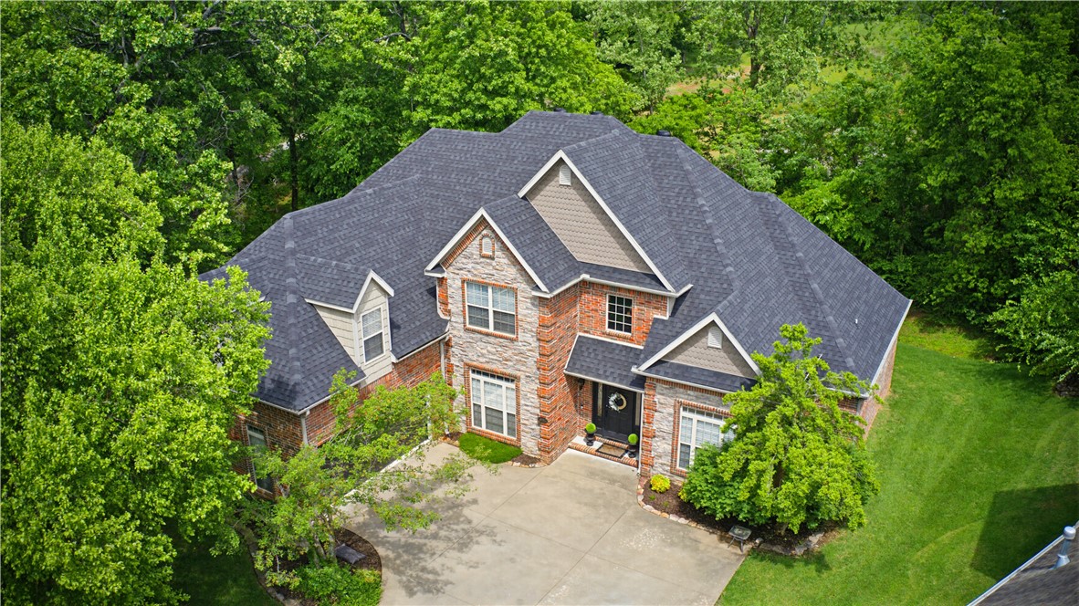 Elegant 5BR/4BA residence in sought-after Covington Park, offering a thoughtfully designed split floor plan and exceptional functionality throughout. A welcoming foyer opens to both a formal living area and a dedicated formal dining room with a gas fireplace —ideal for hosting and entertaining.
The kitchen is designed for everyday living and gatherings, featuring a gas cooktop, double ovens, generous pantry, and a light-filled eat-in dining area.
The private primary suite is tucked away on the main level,  an additional en-suite bedroom with two secondary bedrooms, and a dedicated office—offer flexibility without compromising privacy.
Upstairs, a spacious bonus/game room, bedroom, and full bath provide an ideal retreat for guests or additional living space.
Outdoor living is equally inviting, with a pergola covered back deck overlooking the backyard-perfect for relaxing or entertaining.
Recent updates include a new roof (2021) and two HVAC units (2022). * Additional Office and Bonus Room