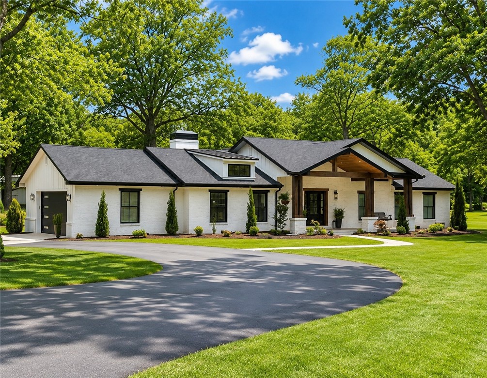 Beautiful home and land close to all Siloam Springs has to offer yet outside of city limits.