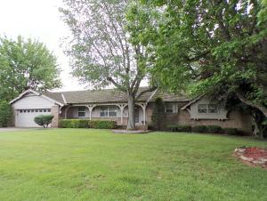 This very well maintained home is located minutes from downtown. It is on a nicely landscaped lot with an 18 x 38 in ground pool for your enjoyment. Privacy fenced back yard. Deck. 4 bedrooms, 3 baths, large master bedroom with a Whirlpool tub. Living area is open. Man Cave or den in basement with wet bar. Gas log fireplace. New carpet thru out. All pool equipment stays including Robotic Pool Cleaner. This is a must see!