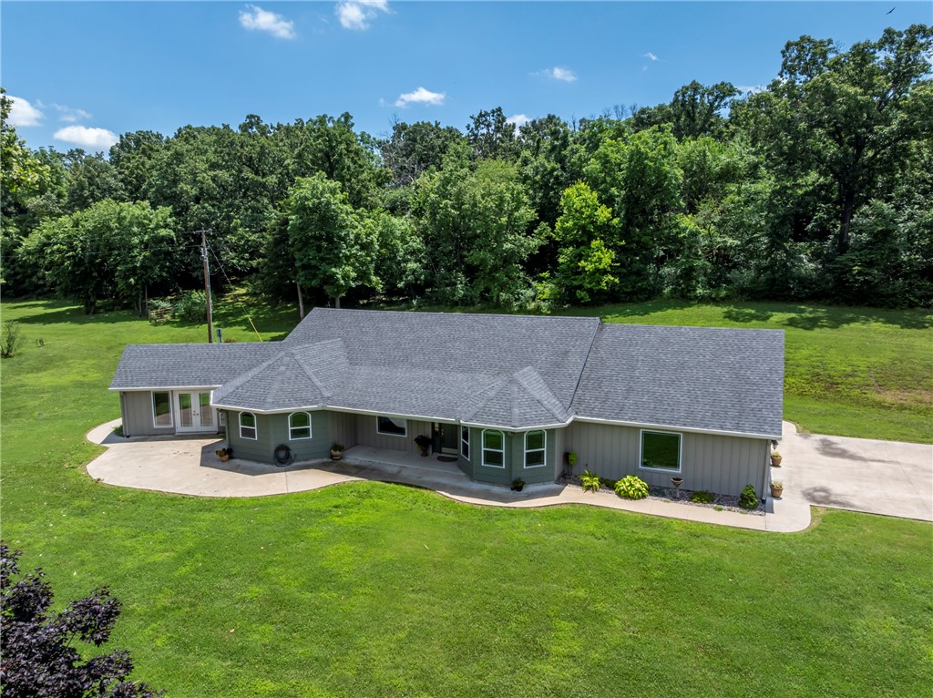 Welcome to 23001 Honey Creek Rd! This beautiful home was completely redesigned and expanded in 2020. It blends comfort, style, and everyday functionality. Large kitchen with timeless alder cabinets, custom pantry, with a large island showcasing sleek stone counters offers the perfect spot for cooking, dining, and connecting. The primary bedroom provides a peaceful retreat, with an ensuite bathroom. There is a second primary suite, third bedroom or second office, great room, and living area opens to the formal dining. The expansive acreage features gently rolling pastures, dotted with mature trees, a year-round creek and a wooded area behind the home.  The creek winds across the land, adding a peaceful and picturesque element—perfect for enjoying quiet mornings and exploring nature. The property includes a detached shop with three overhead doors-ideal for equipment storage, or hobbies. Hookups for a second home is located east of the house. This is a must-see property!