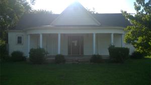 Step back into a more relaxed time when families set on the front porch, sipped iced tea, visited with friends or gathered around a large table for Sunday dinner, in this charming historical home you can do both!!  Large front porch is just right for sitting and sipping tea, inside features large living area, dining room with plenty of room for large table to enjoy a Sunday meal, included in this