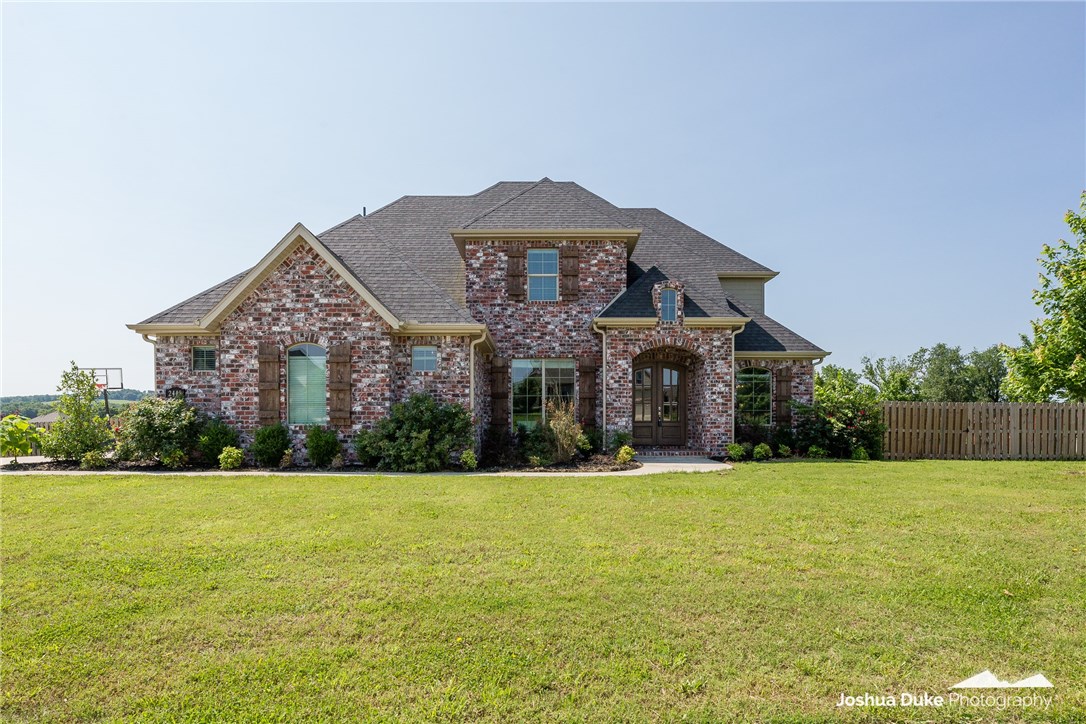 Beautiful 4 Bedroom, 3.5 Bath with Bonus Room, office and dining room located in Waterford Estates. This stunning kitchen has white granite counter tops, island, and wet bar with wine fridge. Kitchen also includes 5 Star Energy Efficient Frigidaire appliances, double ovens and 5 burner gas stove top. The large backyard is perfect for entertaining, with a covered patio with gas log fireplace, built in BBQ grill, and space for a small fridge. The house sits on a large corner lot.