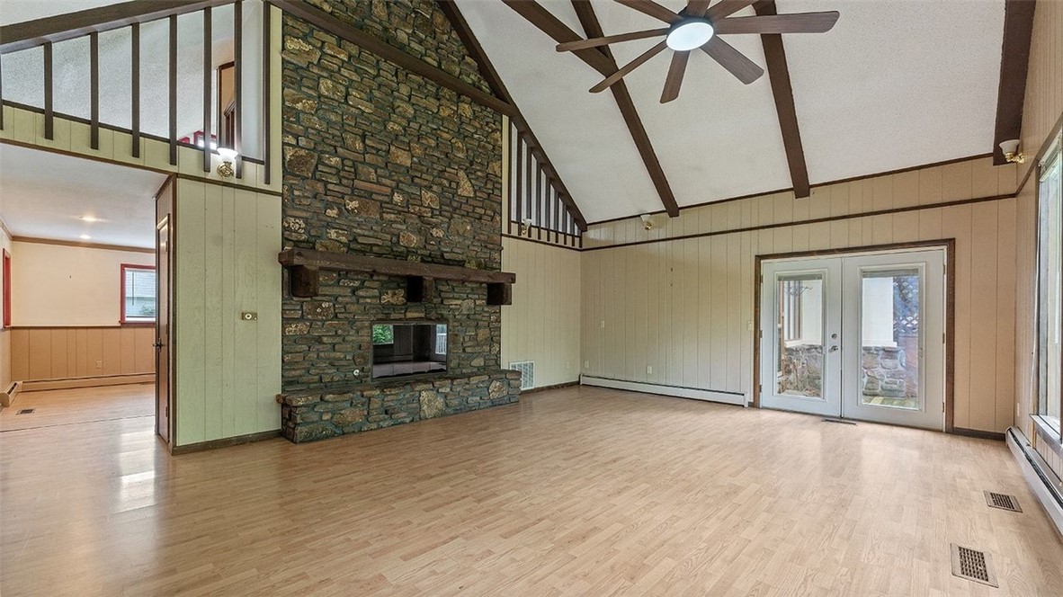 Welcome to this charming home in the Hillview subdivision in Springdale! This spacious residence offers 3 bedrooms and 2.5 bathrooms, providing plenty of space for comfort and entertaining. The main level features a large living room with a stunning native stone fireplace, perfect for cozy gatherings. The kitchen is equipped with stainless steel appliances and beautiful quartz countertops, making meal prep a delight. Upstairs and downstairs bonus rooms provide versatile spaces for a home office, playroom, or additional living areas. Enjoy outdoor living on two decks, ideal for relaxing or hosting friends, all nestled in a private backyard offering plenty of tranquility and seclusion. This home combines style, functionality, and privacy in a fantastic neighborhood setting. Ready for the right buyer to add their own personal style and touch.