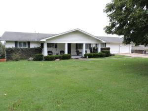 Great family home; large den in basement with kitchen; covered deck & porch; formal living/dining room