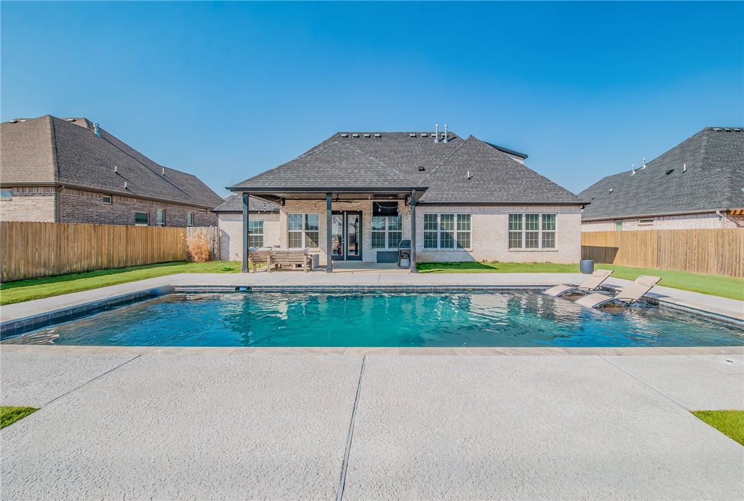 Seller to provide $2,500 credit toward closing costs! Located in the desirable Timber Ridge Park community, this move-in-ready home offers just over 2,800 sq ft on a 0.41-acre lot. The backyard features a heated gunite chlorine pool and a covered patio, creating an ideal outdoor living and private entertaining space. Inside, the main level includes an open concept floorplan with large kitchen with abundant storage, a large island, pantry, and gas range all connected to a bright living room with a fireplace and direct access to the patio. Three main-level bedrooms include the primary suite, and a dedicated office adds valuable flexibility. Upstairs offers a private bedroom, full bath, and a spacious bonus room. A 3-car garage, drop-zone with cubbies, and a well-designed laundry room complete this functional and desirable floor plan in a sought-after location close to parks, shopping, restaurants and I-49.