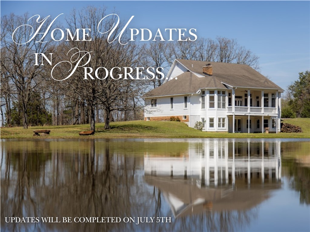 EXCITING New Home Updates are in progress- to be completed by July 5th! This charming 6 bed, 5.5 bath New England style home is set on 4.45-acres tucked away in the Prairie Grove hillside. This estate features a stocked bass pond that serves as the centerpiece of your private oasis. Newly updated in March '26, boasting new paint, carpet, light fixtures, countertops, contemporary hardware & a newly poured concrete slab. Inside, the character of this home is one-of-a-kind with original wide cedar plank flooring that pairs beautifully with the wood fireplace in the living room. The large windows fill each room with natural light & provide views of the rolling landscape. Downstairs enjoy the wood-burning stove in the additional living room. The home is equipped with a geothermal heating/cooling system. Retreat to the two-story back porch to enjoy your view of the water & surrounding landscape. This property is a rare opportunity to enjoy a classic, updated home with a fishing pond steps from your door.