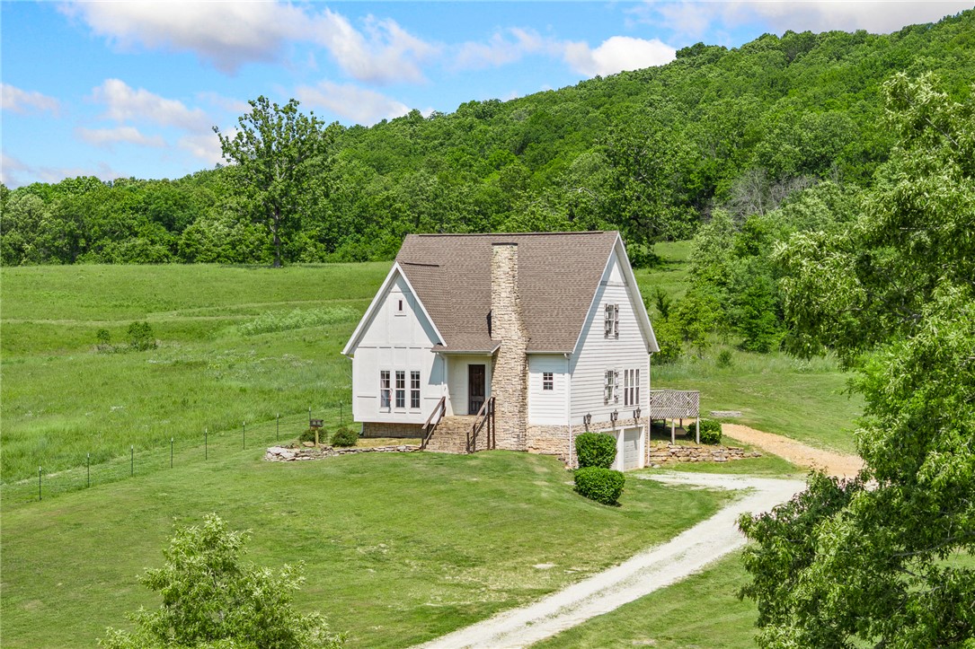 If you've been waiting for a second chance at this one, now is the time! Welcome to 6935 Bear Creek Dr, a beautiful 3-story home nestled on 3 peaceful acres just outside the city limits. This spacious property offers 3 bedrooms, 3 full baths, a cozy stone fireplace with an electric insert, granite countertops, stainless steel appliances, a large primary suite featuring an oversized walk-in closet, and a whole house water treatment system. Love the outdoors? You'll appreciate being just 0.3 miles from Bear Creek and the historic Haggard Ford Swinging Bridge, making it easy to enjoy all the natural beauty the area has to offer. With privacy, space, and a location that's hard to beat, this home is ready for its next owners. Schedule your showing today!