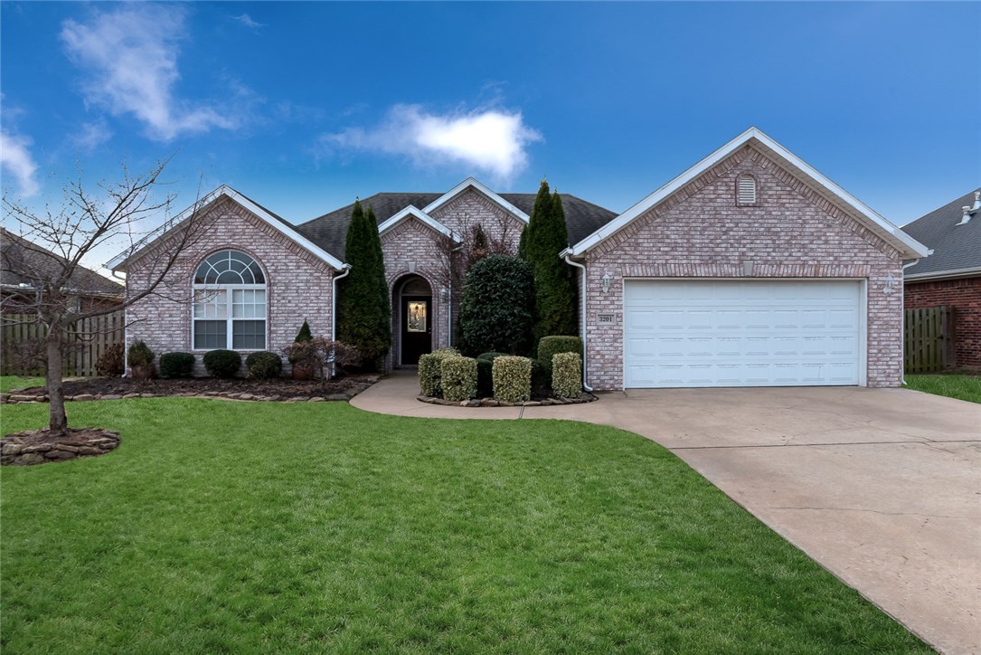 Bentonville beauty in a great location near Walmart home office ! Well cared for all brick home hosts 4 bedrooms with built in's & two closets in bedrooms, formal dining and wired for a security system. Features include new paint throughout, kitchen w/granite counters and breakfast bar, rounded corners, archways, split bedroom plan and hardwood floors and trey ceilings. Master suite w/jacuzzi tub, double sinks, walk-in closets & separate shower. Covered back patio overlooks wood privacy fenced back yard with storage shed. Completely sodded lawn w/ landscaping,& sprinkler system.