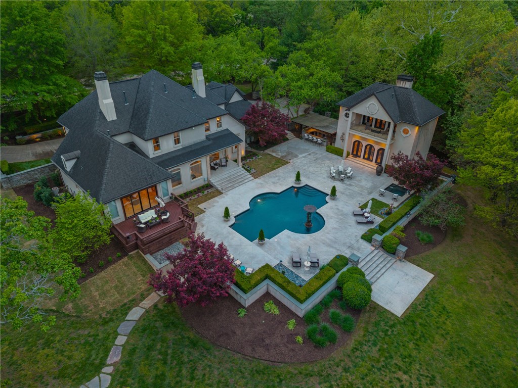 Stunning resort-style living at its finest. This exceptional estate offers the perfect blend of luxury, privacy, and thoughtful design, all set on 3.27 beautifully landscaped acres.

From the moment you arrive, you’re welcomed by a grand entrance with a striking fountain and meticulously maintained grounds that set the tone for this one-of-a-kind property. Inside, the home showcases exquisite craftsmanship with expansive marble flooring, custom lighting, and a dramatic custom iron staircase.

Designed for both everyday comfort and elevated entertaining, the home features a private office, media room, playroom, and a stunning sunken living room filled with natural light. 

Step outside to your own private retreat—complete with a resort-style pool, lush gardens, and serene creek frontage on two sides that meet at the back of the property, offering unmatched beauty and tranquility.

Entertainer’s dream, featuring a wine cellar, built-in keg tap to the movie room, and a fully equipped outdoor kitchen.