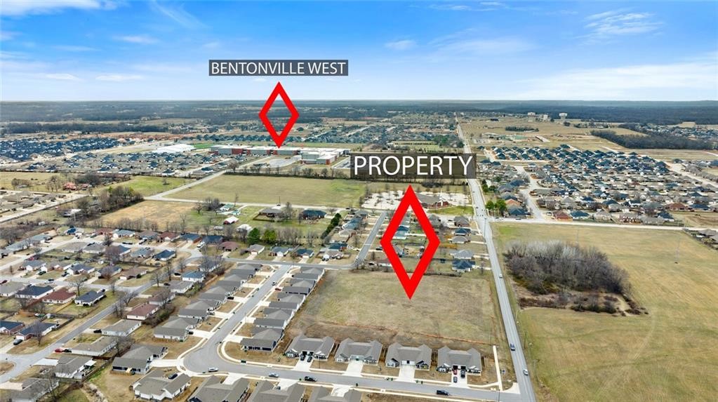 Exceptional rare opportunity to own 3 acres of flat, cleared land in a high-demand area of Centerton, on Gamble Road. Currently Zoned R-3 SFR. C-3 Commercial rezoning possible  as per the City of Centerton. Boasting over 300 feet of frontage along highly visible Gamble Road, this prime parcel is just 0.3 miles from Bentonville West High School—making it ideal for residential development. Situated in the heart of one of Northwest Arkansas's fastest-growing regions, the property offers unbeatable convenience with close proximity to top-rated schools, major retail centers, restaurants, and daily amenities. City utilities are already on site, or nearby streamlining the development process. Whether you're an investor, developer, or business owner, this location delivers outstanding potential in a thriving community.