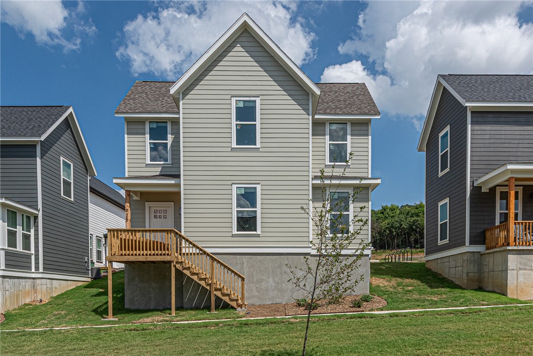 $3,500 LENDER CREDIT offered with buyer’s use of builder’s preferred lender - Use towards rate buydowns or closing costs! (OPEN HOUSES hosted @ MODEL HOME: 1015 N Laramie Heights) Welcome to Southern Woods! A Trailside Community at the base of Centennial Park 2022 Top Outdoor Facility Rating) Location offers access to miles of trails, greenspaces w/ paved pathways, & bicycle stalls, min away to shopping, food, I-49, & U of A campus! 3 BEDROOM PROW COTTAGE floor plan feat: a covered front porch w cedar post, open concept 1st floor w 9’ ceilings, LVP floors, & kitchen w 3cm granite counters, tiled backsplash, center island w sink, stainless steel appliances! Main floor primary bedrm w/ ensuite bathrm! Upstairs 2 more Bedrms w private ensuites & laundry rm! Main floor back deck! POA $35/mo incl lawn mowing! Join this community in a premier location today!