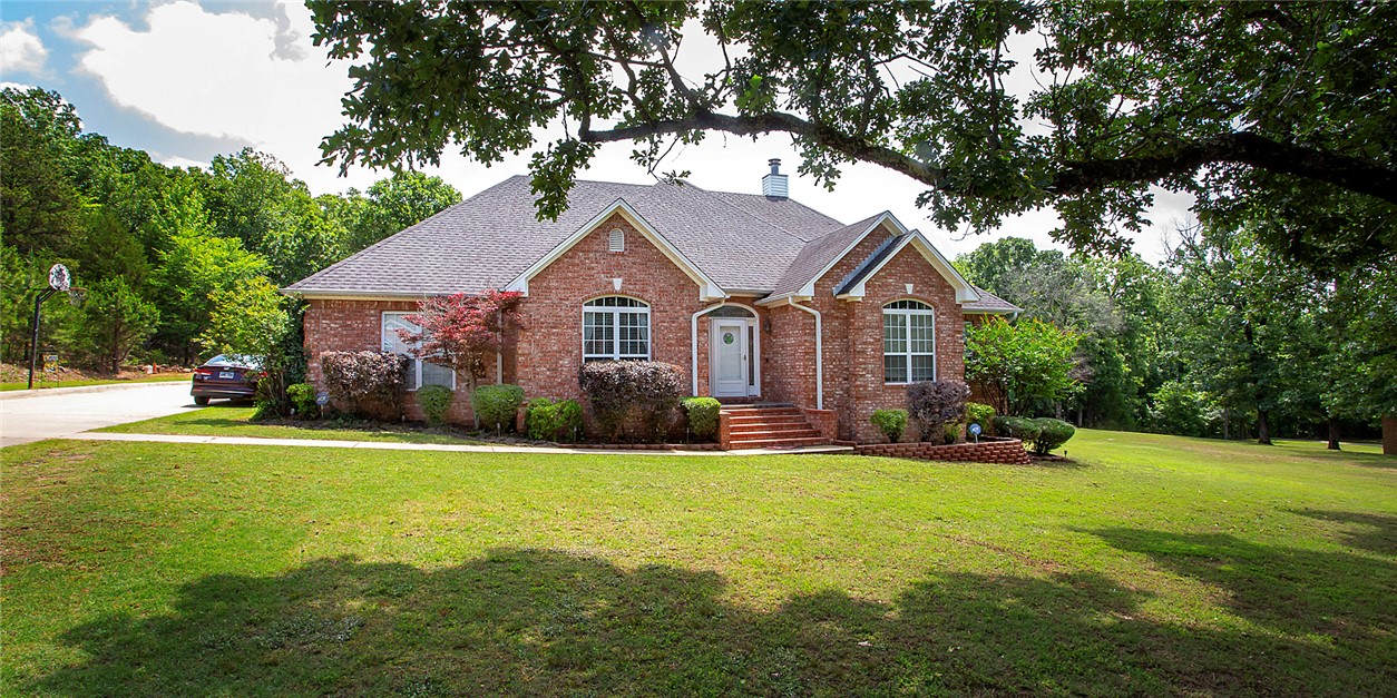 From the beautiful shade trees out front to the incredible layout inside, this home feels like a getaway from the everyday hustle. Nestled on a beautifully shaded lot, this stunning 4-bedroom, 3-bathroom brick home perfectly blends comfort and style. From the moment you step inside, you are greeted by an inviting open living floor plan, complete with a cozy stone fireplace and high tray ceilings. The heart of the home features a dream kitchen outfitted with elegant granite countertops, classic white cabinetry, a subway tile backsplash, and a breakfast bar that opens right into the action. Hosting dinners is a breeze with the dedicated dining space. Need room to adapt? The secondary flex space is ideal for a home office, gym, or game room. The real showstopper is the backyard, perfect for entertaining, boasting an expansive multi-level deck, a built-in bar, and a gravel lounge area. It is fully ready for the next level of weekend cookouts and outdoor fun! Schedule your personal tour today!
