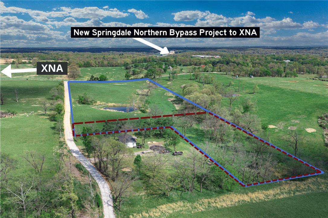 Just 2 miles from XNA Airport, this 2.25-acre parcel sits at the southwest corner of Hendrix and Reams Road in Gentry, offering paved road frontage. This listing is specifically for the L-shaped lot as identified in the attached survey and shown in the listing photos. The land is cleared and gently rolling, with electric, gas, and public water at the street — and the property has already perked for septic. Whether you're building your dream home or an investment property, this is a turnkey-ready lot in one of NW Arkansas's fastest-growing corridors. Refer to survey for exact boundaries.