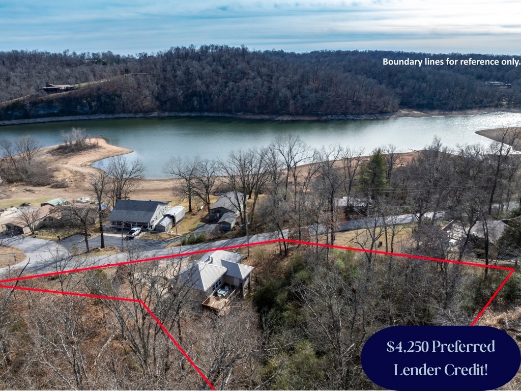 MODERN LAKE LIVING! Discover 13934 Canal St in the sought-after Monte Ne Shores—a versatile gem perfect as a TURN-KEY short-term rental, secondary retreat, or permanent residence. This 3BR/2.5BA home features a sleek, modern interior and a main-level balcony made for sunset views. The kitchen is a standout, featuring a dedicated coffee bar and pantry. Retreat to the private basement-level Master Suite, a true sanctuary with a full ensuite, walk-in closet, and dedicated office space. This home is built for efficiency and comfort with a NEW furnace, NEW washer/dryer, and a high-efficiency outdoor wood furnace as an additional heating option! Outdoor living is elevated with a fully fenced yard, hot tub, smoker/grill, and abundant seating. The garage offers flexible space for parking or a game room. Best of all, public lake access is just a short walk or golf cart ride away. Sold FULLY FURNISHED and ready to perform or enjoy. Experience the best of Beaver Lake with modern style and total peace of mind!