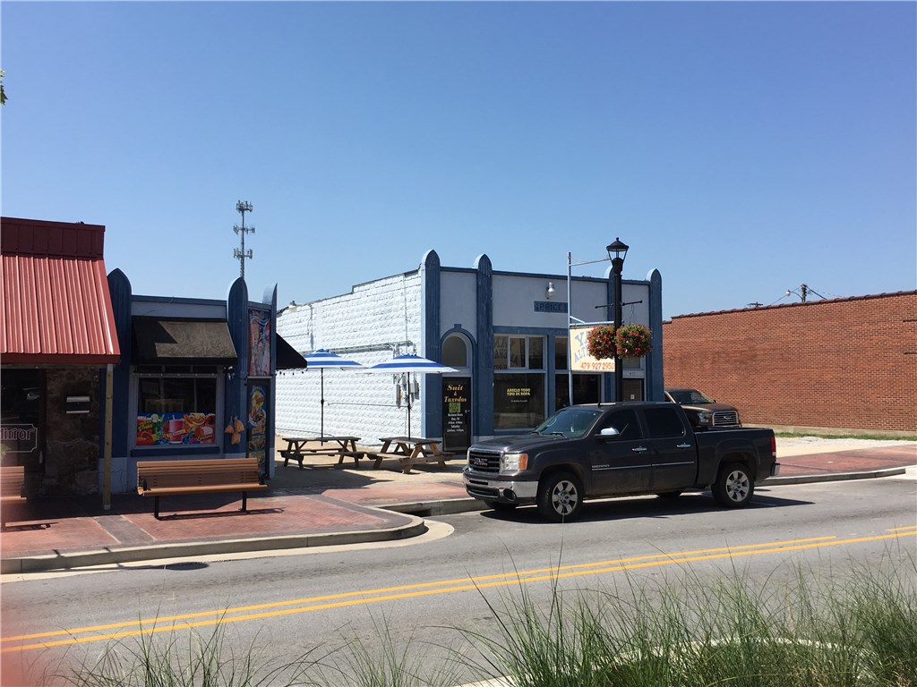 Invest in the revitalization taking place on Emma Avenue, downtown Springdale, AR!  This is an extremely unique property with many opportunities for someone to consider!  Currently, there are 3 businesses fully operating on the property, there is a parking lot, a drive thru lane, 3 separate buildings fully functioning separately.  Please don't disturb the current businesses, schedule an appointment.  Owner occupied.