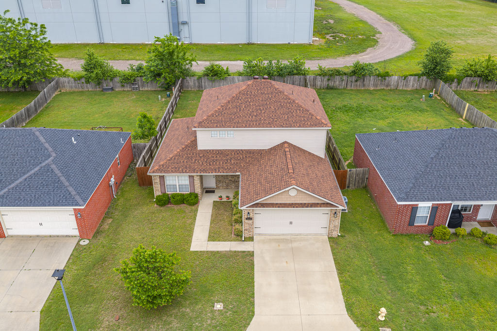 Move-in ready split-level home in desirable Fort Chaffee Crossing. This well-maintained 2-story property offers 3 bedrooms, 2.5 baths, and an additional upstairs family room—perfect for a second living area, office, or playroom.

Recent updates include a newer roof and gutters, plus energy-efficient double pane windows. The low-maintenance exterior features a combination of brick and vinyl siding for lasting durability and curb appeal.

Enjoy outdoor living with covered front and back patios, along with a large, fully fenced backyard ideal for entertaining, pets, or relaxing.

Additional highlights include a 2-car garage, attic storage, and all appliances included. Spacious, functional layout and truly move-in ready—don’t miss this opportunity.