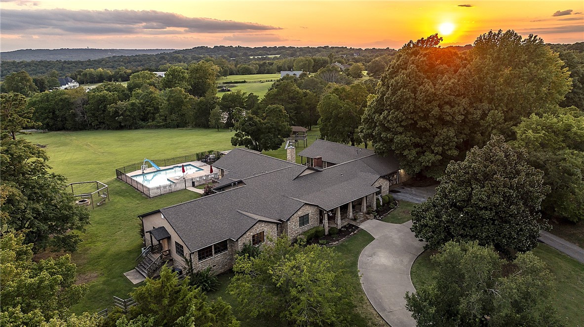 Estate property featuring custom-built, 5558 square foot, one-level Craftsman home, on 5.6 gently rolling acres. 6 bed, 4.5 bath, 2 bonus rooms, open floor plan family room with floor to ceiling windows with scenic views across river valley and mountains. New multi-use 4340 sq ft Barn/ADU built in 2022 for recreation, fitness, workshop, garage, and 840 sq ft of dedicated storage; with 1.5 baths and granite topped full kitchenette. In-ground pool, private drive, 2 laundry rooms, new roof 2022.