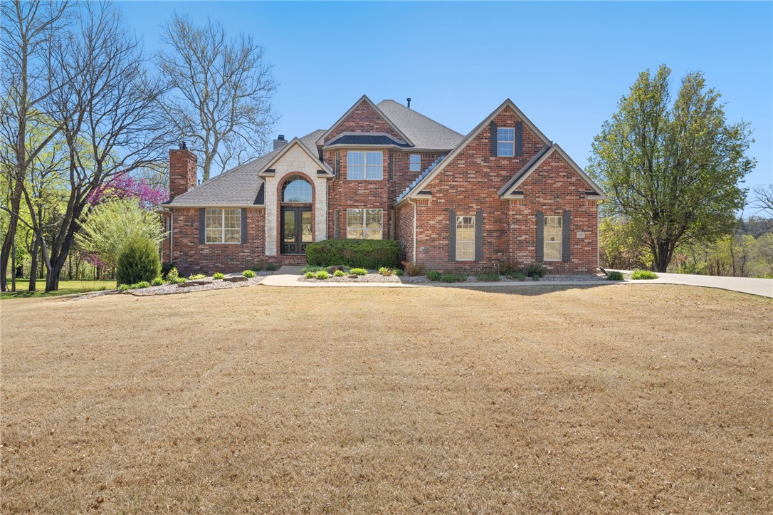 Nestled on two private acres in the prestigious, gated Bordeaux Village along the White River in East Fayetteville, 5-bedroom, 4.5-bath custom estate offers more than 4,700 square feet of living space and timeless design. The main level is thoughtfully designed, featuring a luxurious primary suite, 1.5 baths, a gourmet chef’s kitchen, an elegant dining room, private office, and a spacious living area anchored by a beautiful fireplace. Expansive windows frame breathtaking views of the White River, while the large deck provides outdoor entertaining, immersed in nature. Also, a generously sized walk-in laundry room. Upstairs, you’ll find three large bedrooms, two full bathrooms, and a versatile flex space ideal for a media room, playroom, or additional lounge area. The walk-out basement offers incredible flexibility and privacy with a second primary suite, full bath, two large cedar-lined closets, abundant storage, and a full-sized garage spacious enough to accommodate a boat. Truly rare opportunity.