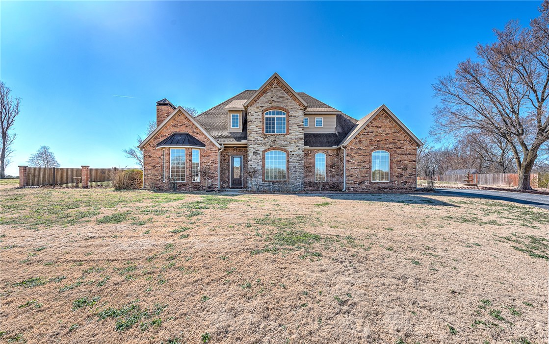 Gracefully set on approximately 1.03 acres, this beautifully maintained home offers a rare balance of privacy, comfort, and luxury. The peaceful setting creates a sense of retreat while remaining conveniently close to schools and everyday amenities. Inside, the home features a warm and thoughtfully designed layout ideal for both daily living and entertaining. The primary suite on the main level provides comfort and privacy, complemented by a spacious walk-in closet. Multiple living areas, a dedicated office, bonus room, and abundant storage enhance functionality, while granite countertops, a gas range, and timeless finishes add a polished yet inviting feel. Outdoors, the backyard becomes a private oasis with a sparkling saltwater pool, perfect for relaxing or gathering. A standout 2,700 square-foot detached shop building offers epoxy floors, multiple bays, and electric and water in place, with an upstairs area providing excellent future flexibility. This home is designed to be enjoyed inside and out.