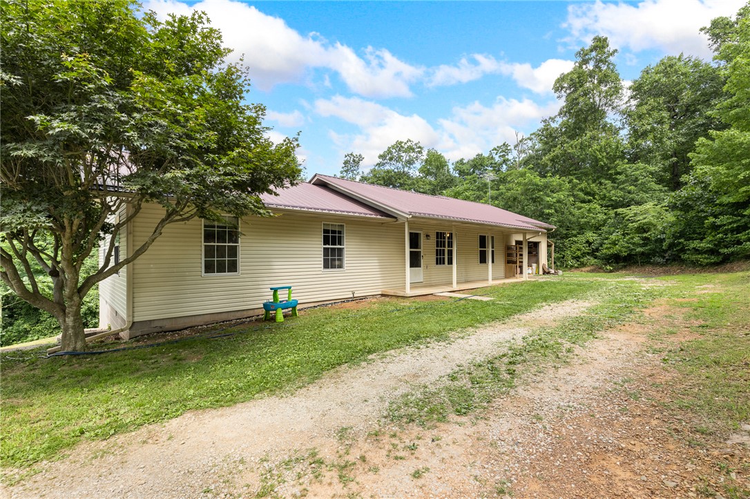 Tucked away in the scenic Ozarks of Deer, AR, this private country retreat sits on 2 beautiful acres surrounded by mature timber and breathtaking mountain views. Enjoy the perfect balance of peaceful seclusion and easy access to the highway. Inside, durable vinyl flooring runs throughout the home for easy maintenance, while the attached garage adds everyday
convenience. Relax on the covered front porch and take in the sights and sounds of nature. Whether you're looking for a full-time residence, weekend getaway, or hunting basecamp, this property offers the privacy, scenery, and country lifestyle you've been searching for.