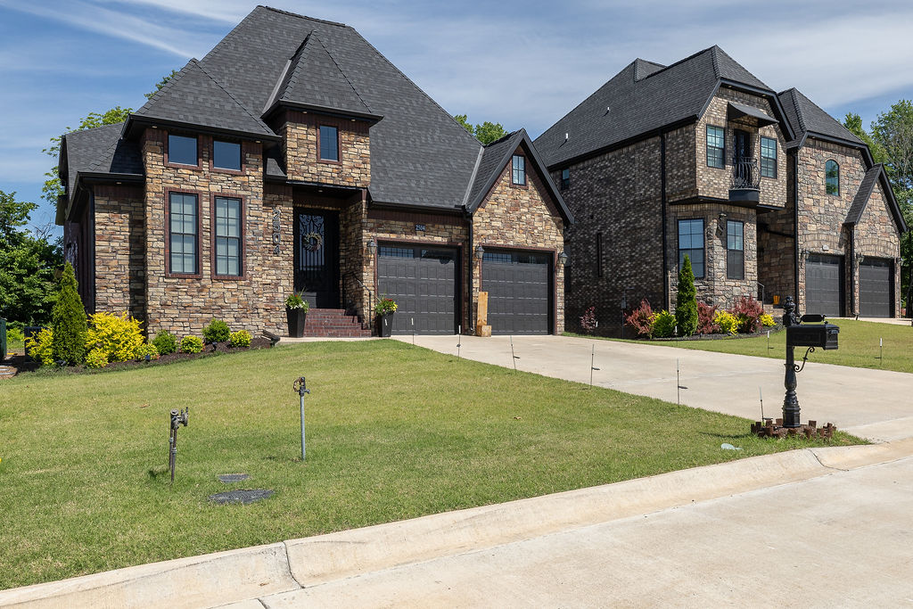 Ideally located on Crossover with quick access to everything Northwest Arkansas has to offer, this 4 bed, 3 full and 2 half bath home blends space, function, and thoughtful design. The main level features open, connected living with luxury-style tile throughout the shared spaces, cased windows, and a large kitchen offering abundant cabinetry and countertop space.

Designed for flexibility, the layout includes both the primary suite and a guest en-suite on the main level, along with a formal dining room and dedicated office. Upstairs, you’ll find two additional bedrooms, a spacious bonus room, and a second living area perfect for media, play, or additional entertaining space.

The generous primary suite offers a spacious bath and oversized closet, while practical conveniences include two laundry areas—one upstairs and one located in the primary suite. Outside, enjoy a covered back porch overlooking the backyard, plus a two-car garage completing this well-appointed home in a highly accessible location.