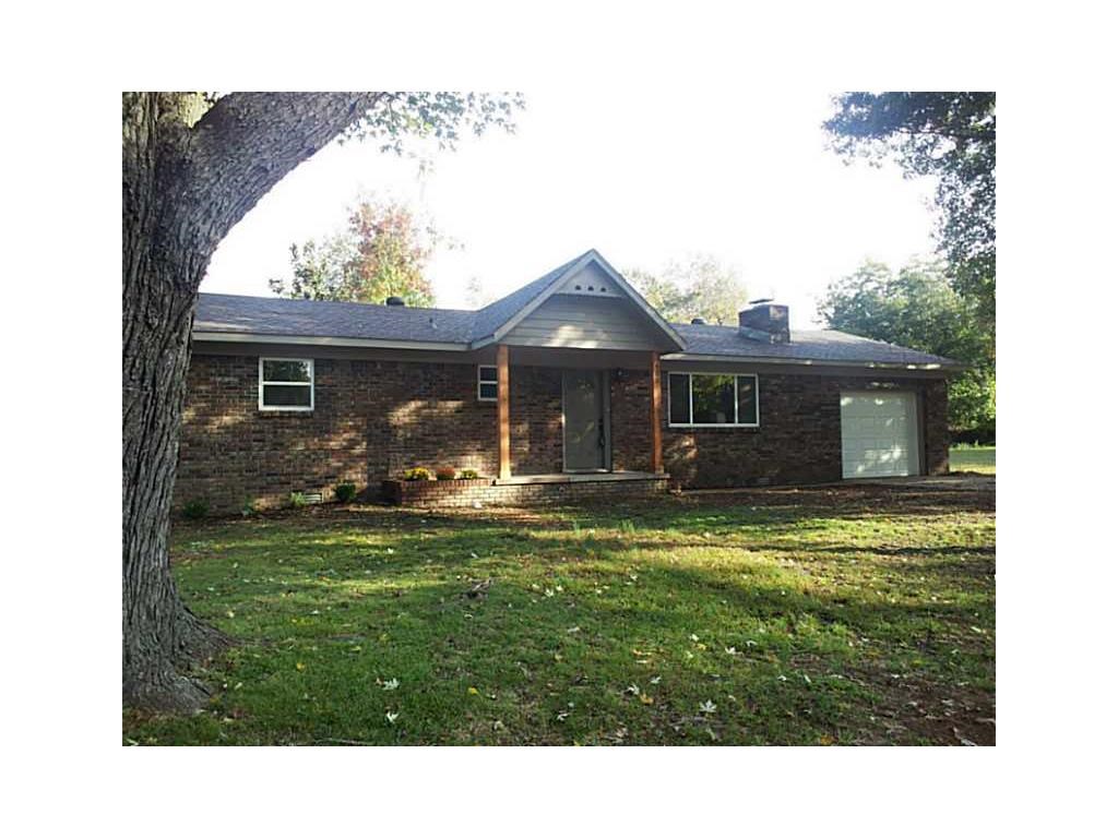Great location and total remodel less than two years ago:  new roof, cabinets, flooring, windows, CH/A unit, sinks, toilets, tub, door, trim, paint, sheetrock, appliances, water heater and garage door.  New privacy fence last year. New blinds though out.  Wood burning fireplace.