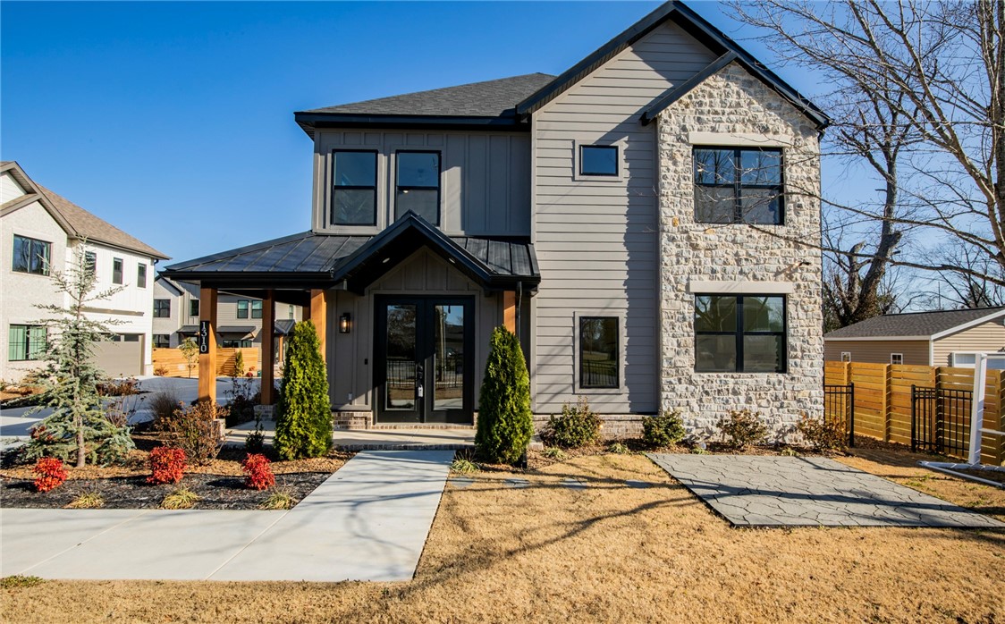 Welcome to this beautiful luxury pocket neighborhood, just a short walk or bike ride from the lively downtown Bentonville area. Enjoy easy access to scenic biking trails and the charming vibe of this highly desirable location. You'll be close to schools, parks, shopping, and dining—all within reach. This stunning custom-built home features five spacious bedrooms and 3.5 bathrooms, carefully designed for comfort and style. The chef’s kitchen is a dream come true, with top-of-the-line appliances, plenty of counter space, and elegant cabinetry—perfect for entertaining or everyday living. An open floor plan seamlessly connects the inviting living areas, filled with natural light and showcasing exceptional craftsmanship and attention to detail throughout!