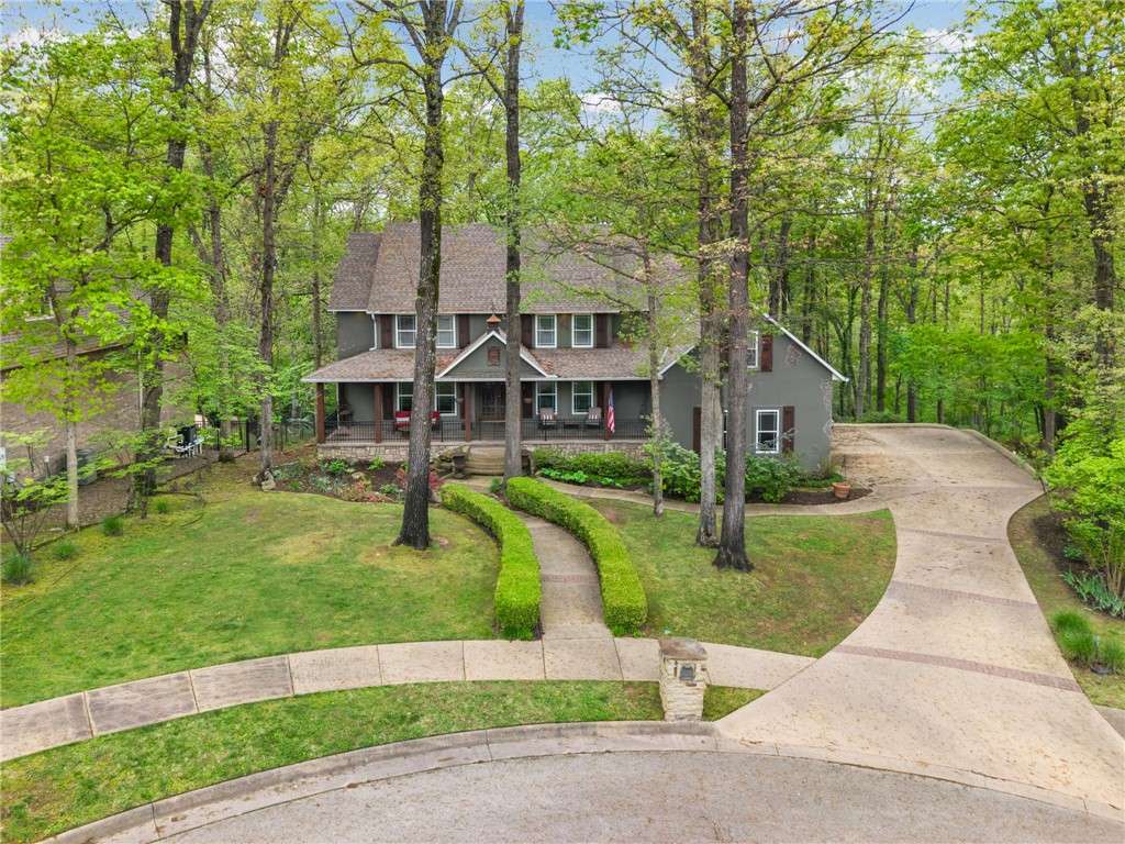 Amazing home in North Bentonville’s Hidden Springs Neighborhood on a beautiful 1.13 wooded acre lot with direct access to “Tristan’s Trail” and all North Bentonville Mountain Biking Trails! If you are an avid  mountain biker/trail runner, you can’t get any closer to the trails than having access out your back door! Minutes away from Downtown Bentonville, Museums, Walking Trails, Schools and 1-49 for easy access to all things Northwest Arkansas! Elegant and Spacious home featuring 3 levels, 7BRs, 4.5BAs, Den/Office, Formal Dining, Hearth Room, Bonus Room. Perfect home for a large family or if you love to entertain guests! Upper and Lower decks overlook wooded area perfect for enjoying a moment of peaceful escape in the middle of town.