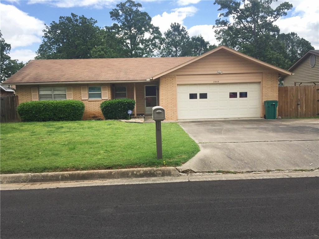 This is a squeaky clean, one owner home. Largest home in quiet neighborhood with 2 car garage. All brick, low maintenance, front landscaping with storm windows and storage building. Chainlink on 3 sides. Living room has w/b fireplace surrounded by build-ins, wood ceiling beams. Heated & cooled sunroom. Bright kitchen,opens to dining room. Baths have new floor tile and fixtures. Sunroom opens to covered back patio. HVAC new 2006.  All appliances stay. Move in ready!