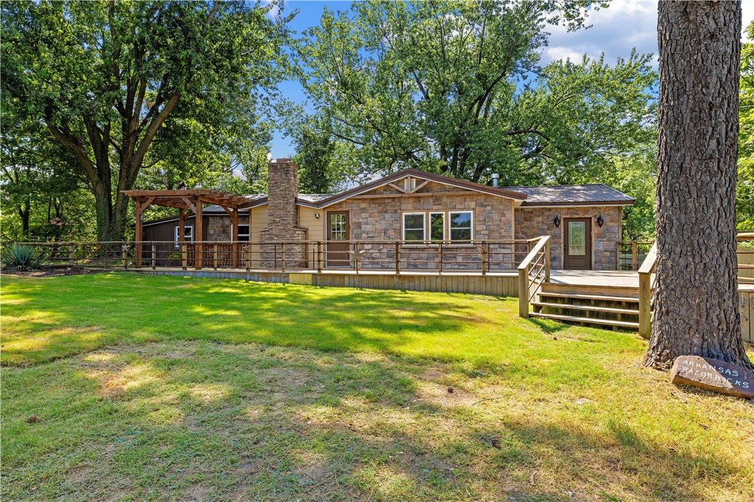 Fabulous opportunity for everything. Almost four acres, multiple outbuildings including steel corrals and property is fully fenced. One has concrete floor, one dirt, may be used for equipment storage or animals. Newly remodeled ranch style home with a western ranch vibe. Close to everything - Home Office, shopping, I-49 but tranquil and soothing.