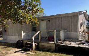 2 Bedroom 1 Bath Mobile on 0.48 AC/ML close to  Harrison Square. New flooring and paint.  Large back yard with outbuilding. Seller will consider owner financing with 20% down.