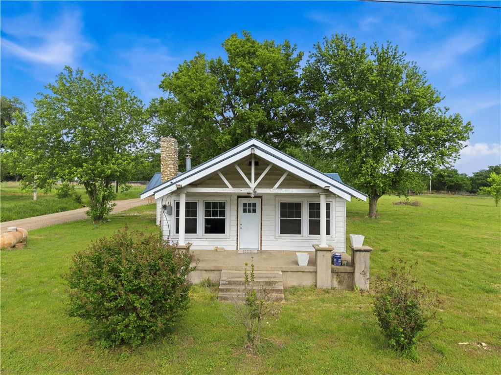 Charming farmhouse on 1.83 acres with excellent highway frontage—perfect for country living with future potential! This 1,140 sq ft home (per CH) features a durable metal roof and a warm, inviting interior highlighted by gorgeous woodworking that adds character and charm throughout. Enjoy the peace of rural living while still being conveniently located just 15 miles to Siloam Springs and only 30 miles to XNA. The property offers plenty of room to expand, build, or develop, making it a great investment opportunity as well. A storm cellar adds extra peace of mind, and the open land gives you flexibility for gardening, animals, or additional structures. Whether you’re looking for a cozy homestead or a property with growth potential, this one checks the boxes!