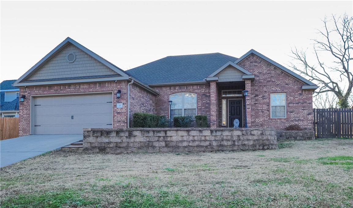 MOTIVATED SELLER!  Location! Location!  Minutes from 71, Bentonville, & Trails.  Spacious Living Rm open into Formal Dining & kitchen/breakfast nook.  Split bedrooms, Kitchen has SS appliances & Granite counter tops.  Gas log Fireplace.  New Ceramic Flooring throughout home. No Carpet!  Enjoy your large flat privacy fenced backyard from the patio or covered porch.  Seller to provide Home Warranty, Refrigerator, Wash/Dryer with acceptable offer.