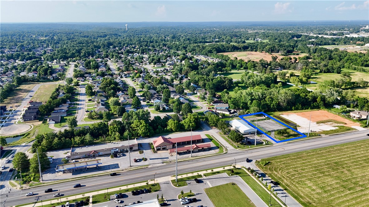 Flexible Opportunity: Ground Lease or Build-to-Suit on adjacent 0.72 Acres | Zoned C-2. Prime location along SW 14th Street (Hwy 102) – a high-traffic thoroughfare and major commercial corridor connecting Bentonville and Centerton. 
• Nearby national tenants include Chipotle, Freddy’s, 7 Brew, McDonald’s, Walmart Neighborhood Market, and Starbucks
• Ideal for QSR, medical, financial, or service-oriented retail users
• Located within minutes of downtown Bentonville, Walmart HQ, and Northwest Arkansas National Airport