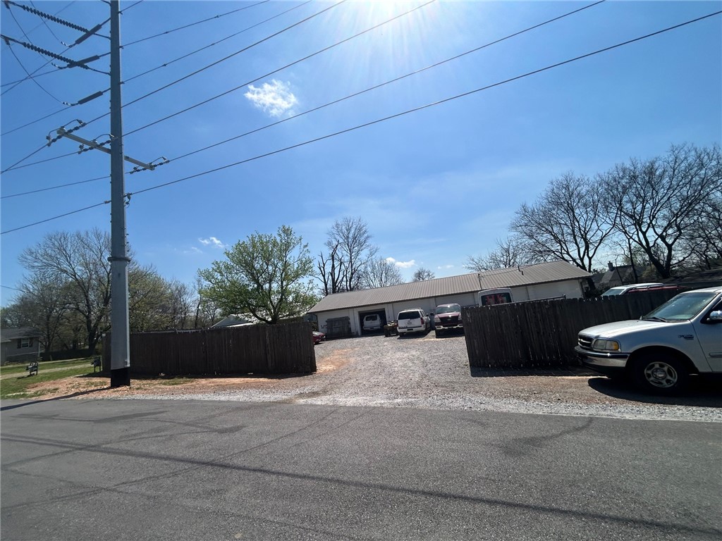 Check out this awesome opportunity in Gravette Arkansas! 2,652 heated and cooled square feet! Already Zoned C1!!! Large chain link fence around 4 sides! 2 1/2 baths!  This has so many good options! Auto Garage, neighborhood store, church, retail, impound lot, wrecker service, or so many other options!