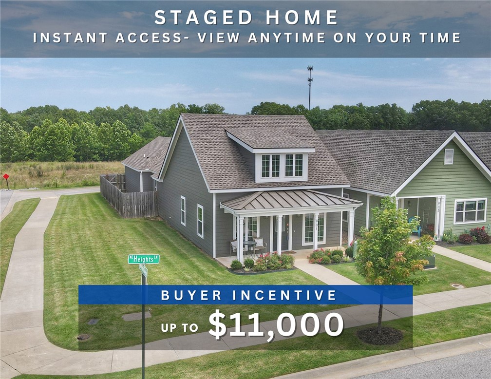 Up to $11,000 BUYER INCENTIVE. Unbeatable location near Crystal Bridges Museum, the Alice Walton School of Medicine, Downtown Bentonville & Walmart’s new campus. Enjoy a vibrant community with top-tier amenities, including a clubhouse, pool, pickleball court, dog park, yard maintenance & access to the countries top premier mountain biking trails. Faulkner floor plan boasts LVP flooring, crown molding, blinds, ample storage & quality throughout. The living room & dining area offer a seamless open floor plan, perfect for entertaining, with abundant natural light & smooth flow into the chef’s kitchen. Chef’s kitchen features 3cm granite countertops, Frigidaire stainless steel appliances, refrigerator, a pantry, tons of storage & abundant natural light. Spacious primary suite includes a perfect ensuite bathroom with walk-in tile shower, double sinks, & large walk-in closet. Patio perfect for entertaining! Oversized garage with ample storage. Staged home at 904 NE Heights Ln.