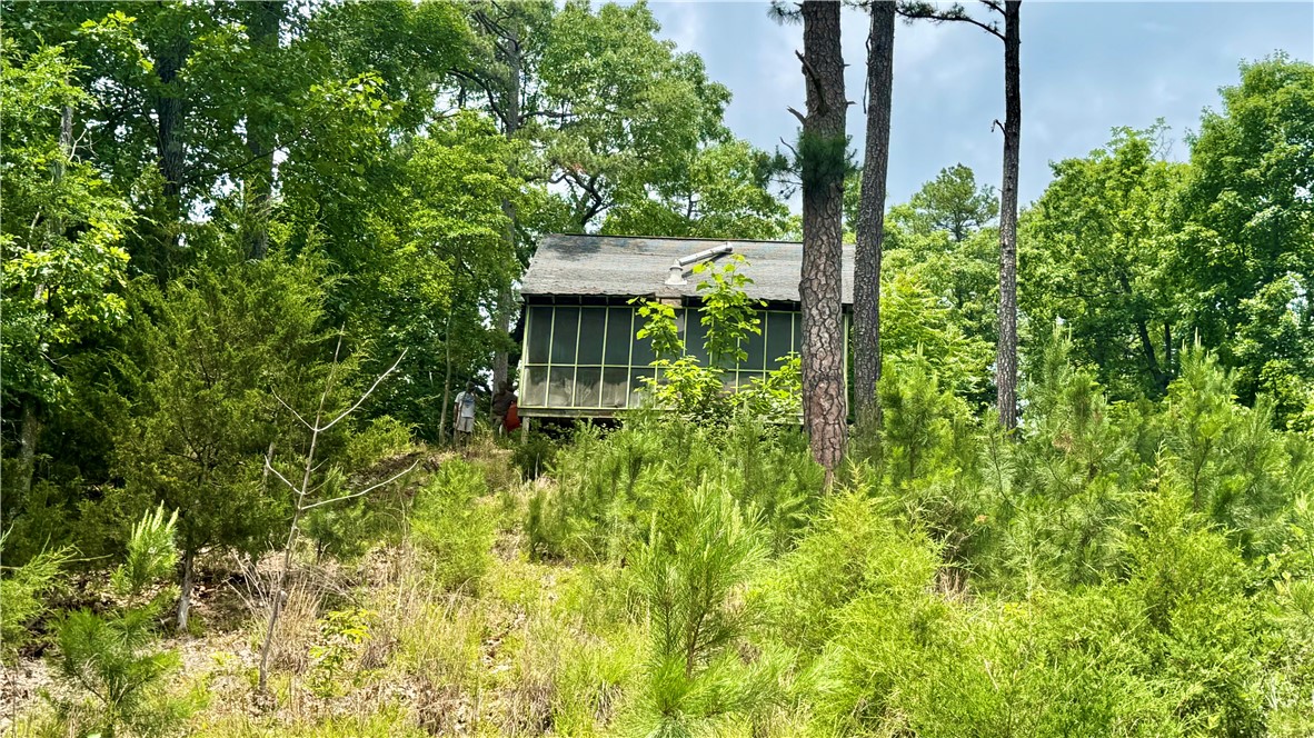 Looking for a Beaver lake get away with Lake frontage,  this is it.  huge rock bluffs with several sites for additional cabins or a building site for a dream home on the lake.  This cabin needs finished out on the inside.
Would not take that much and have a weekend get away.  Almost 6 acres on Beaver Lake.  MUST SEE